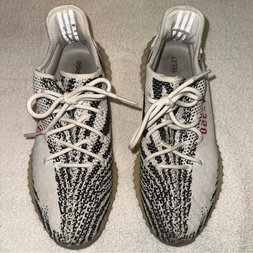 Yeezy Boost. Men’s size 11. White, black, red. Good but worn condition.
